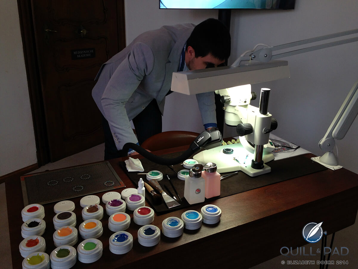 The author, Joshua Munchow, examining the details in the miniature hand paintings on the dial a Louis Vuitton Escale Worldtime