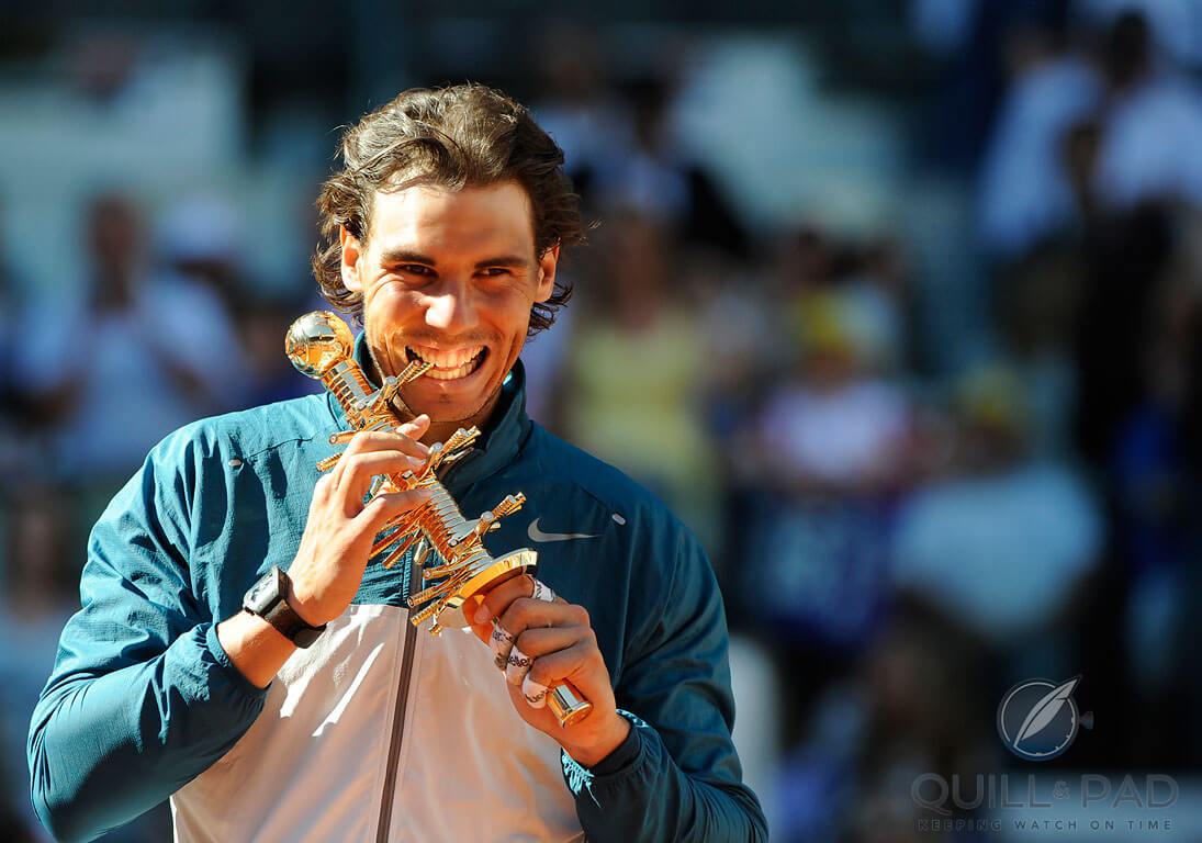 A very pleased Rafael Nadal with the Ion Tiriac Trophy after winning the 2014 Mutua Madrid Open . Phozo courtesy ATP