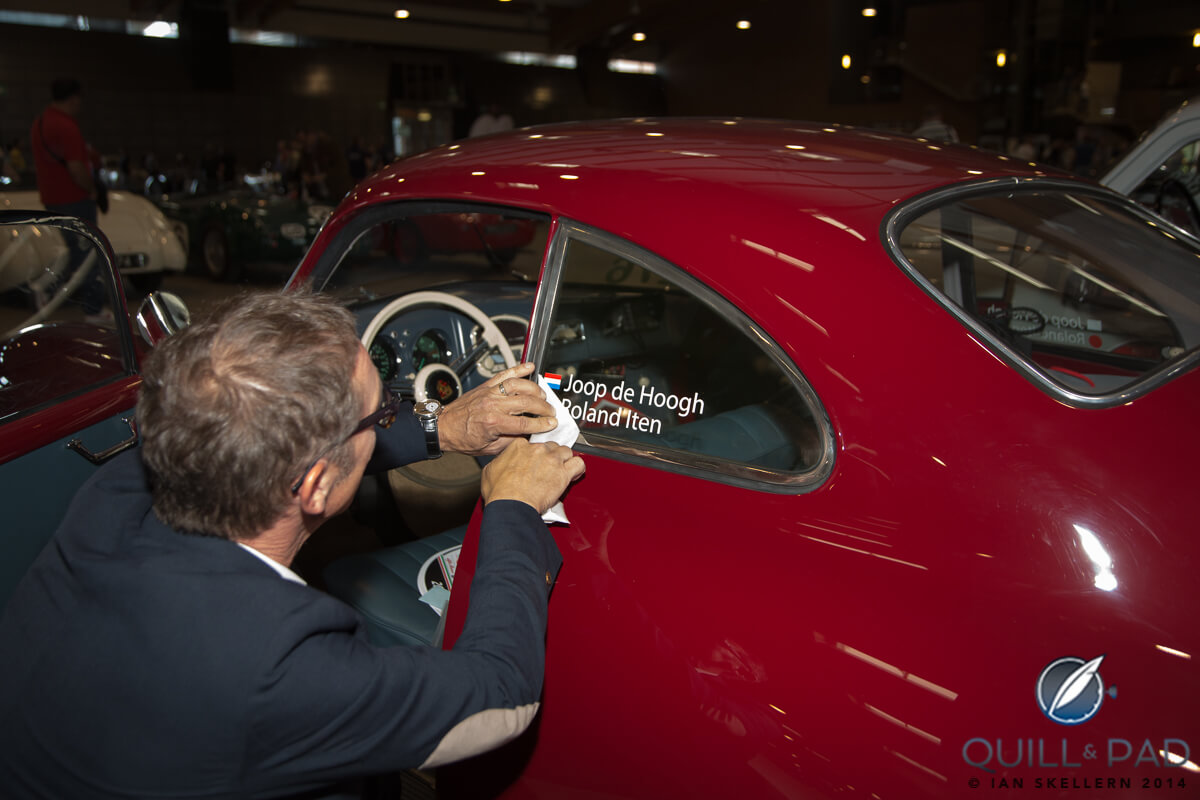 Roland Iten adding the drivers names to the 1953 Porsche 356 pre he will be driving in the Mille Miglia