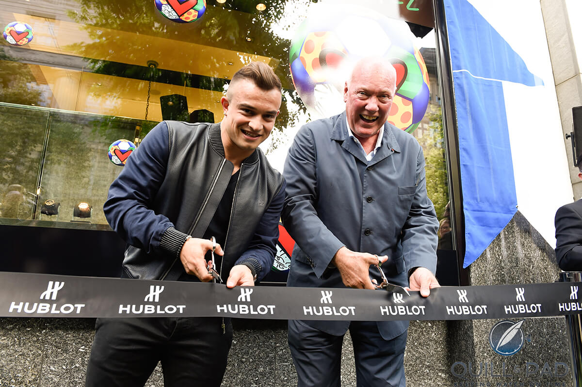Swiss football star Xherdan Shaqiri (left) and Hublot 's Jean-Claude Biver open the Hublot boutique in Zurich
