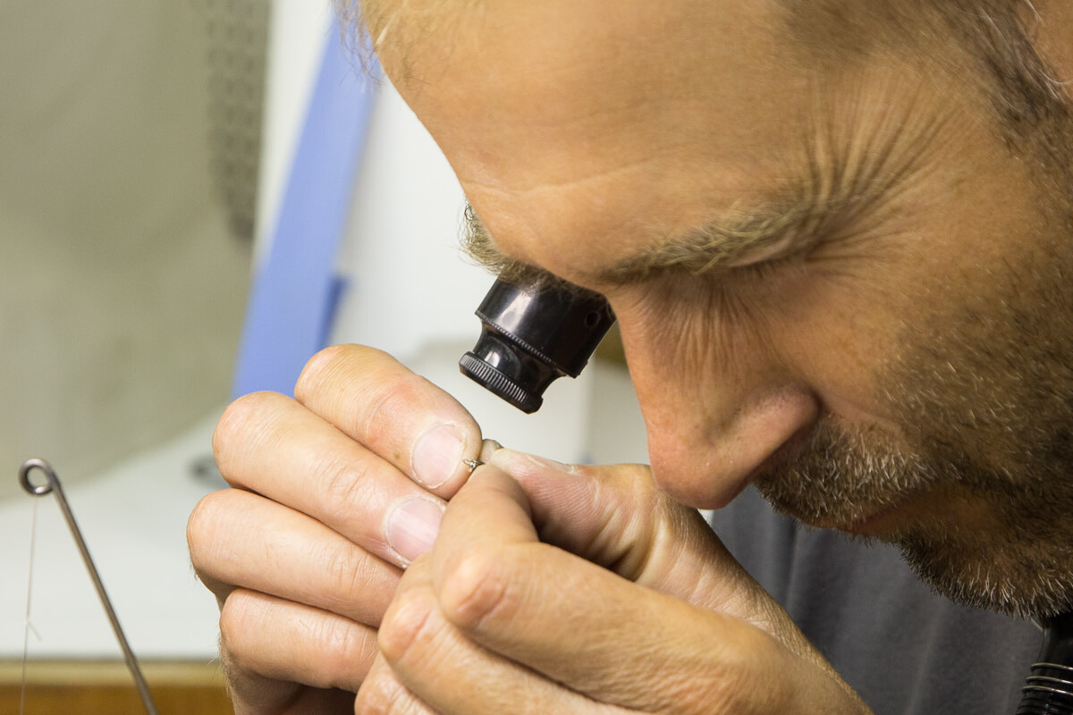 Michel Boulanger examining a newly fabricated component