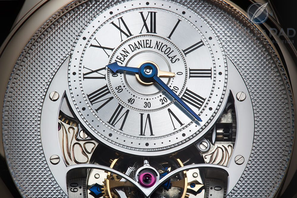 Exquisite dial details of the Jean Daniel Nicolas Two-Minute Tourbillon by Mr. Daniel Roth. At the bottom you can see the blued steel seconds hand on the left size of the tourbillon cage pointing to 60 and the gold seconds hand on the right pointing to 0