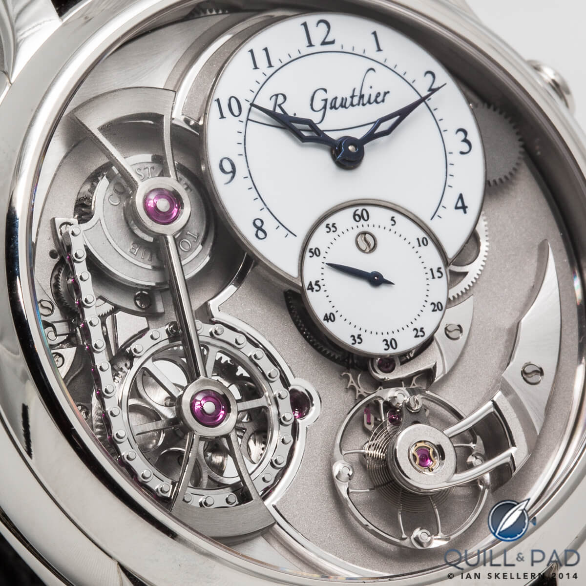 A close look at the dial side of a platinum Romain Gauthier Logical one. Note the chain attaching to the snail cam, long polished constant force bridge and teh elegence of gossamer-thin arms of the balance wheel