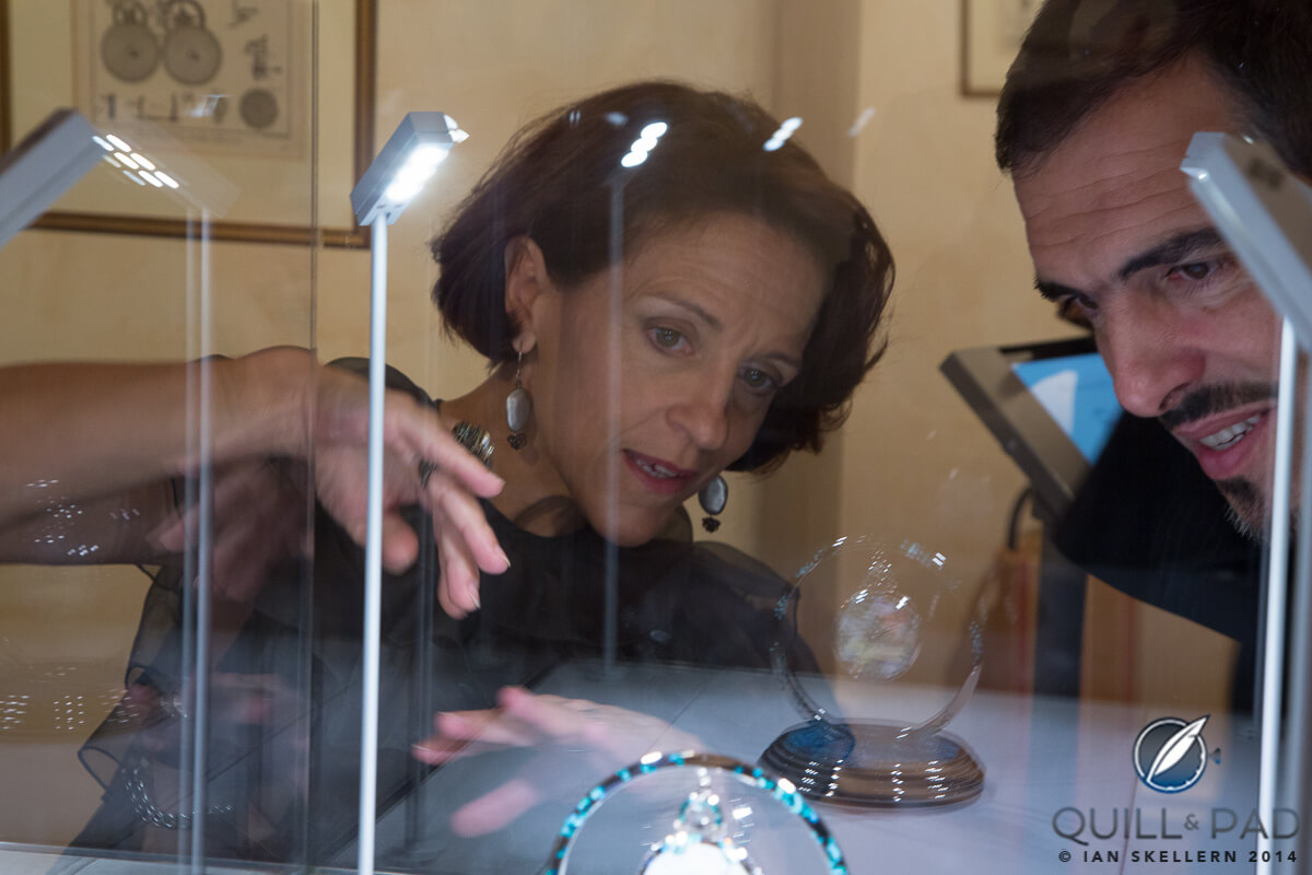 Master enameler Anita Porchet explaining Dawn on the Lake to an appreciative guest