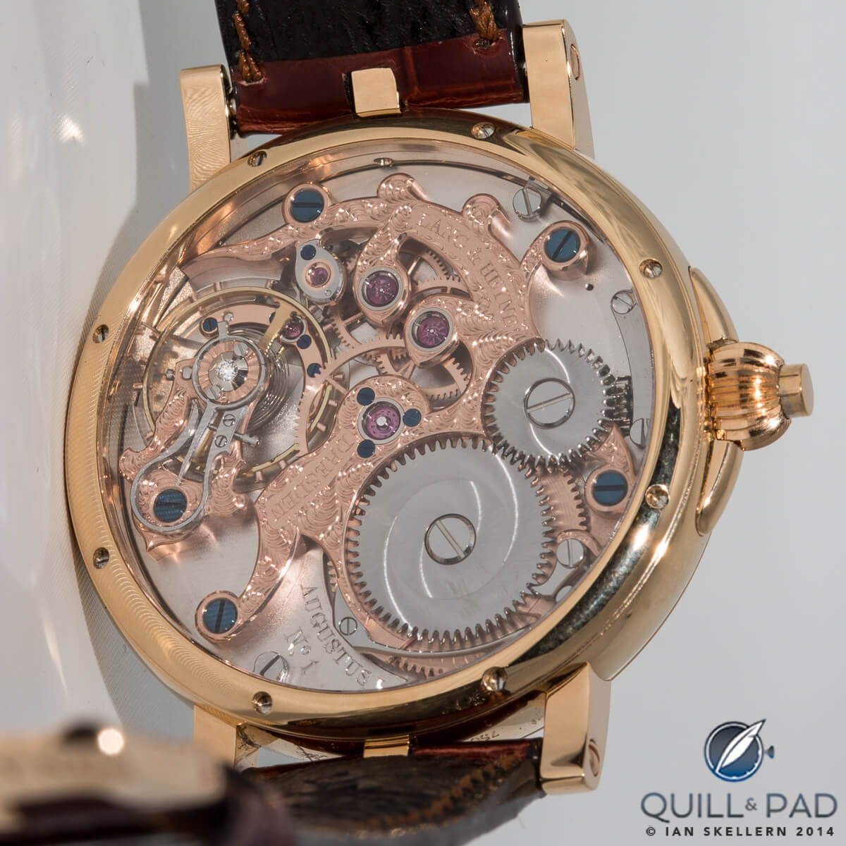 Intricately and ornately engraved bridges visible through the display back of the Augustus by Lang & Heyne