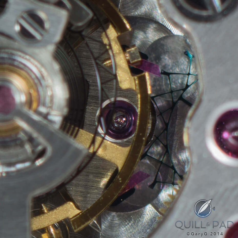 Movement detail showing silicon escape wheel and, in the foreground, one of two silicon balance springs