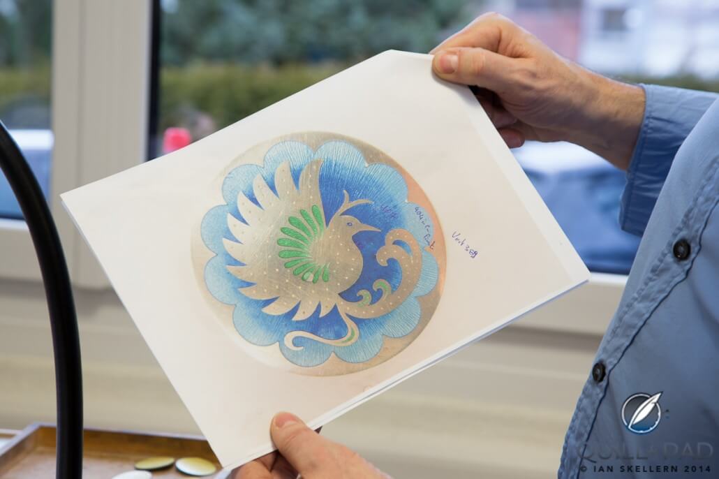 An intricately detailed pattern of a hummingbird is first drawn on paper before being minaturized and 'transferred' to the dial