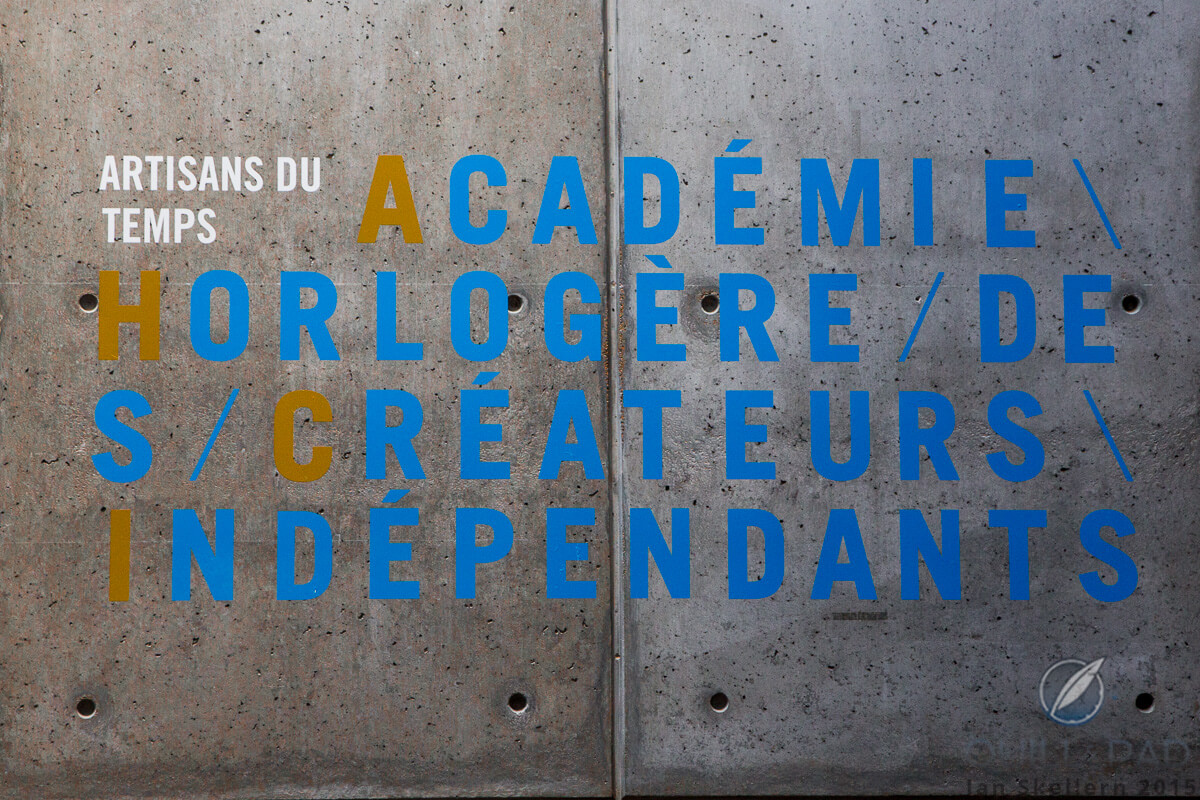 I'm in the right place then: sign sprayed on the wall outside the MIH museum in La Chaux-de-Fonds reading