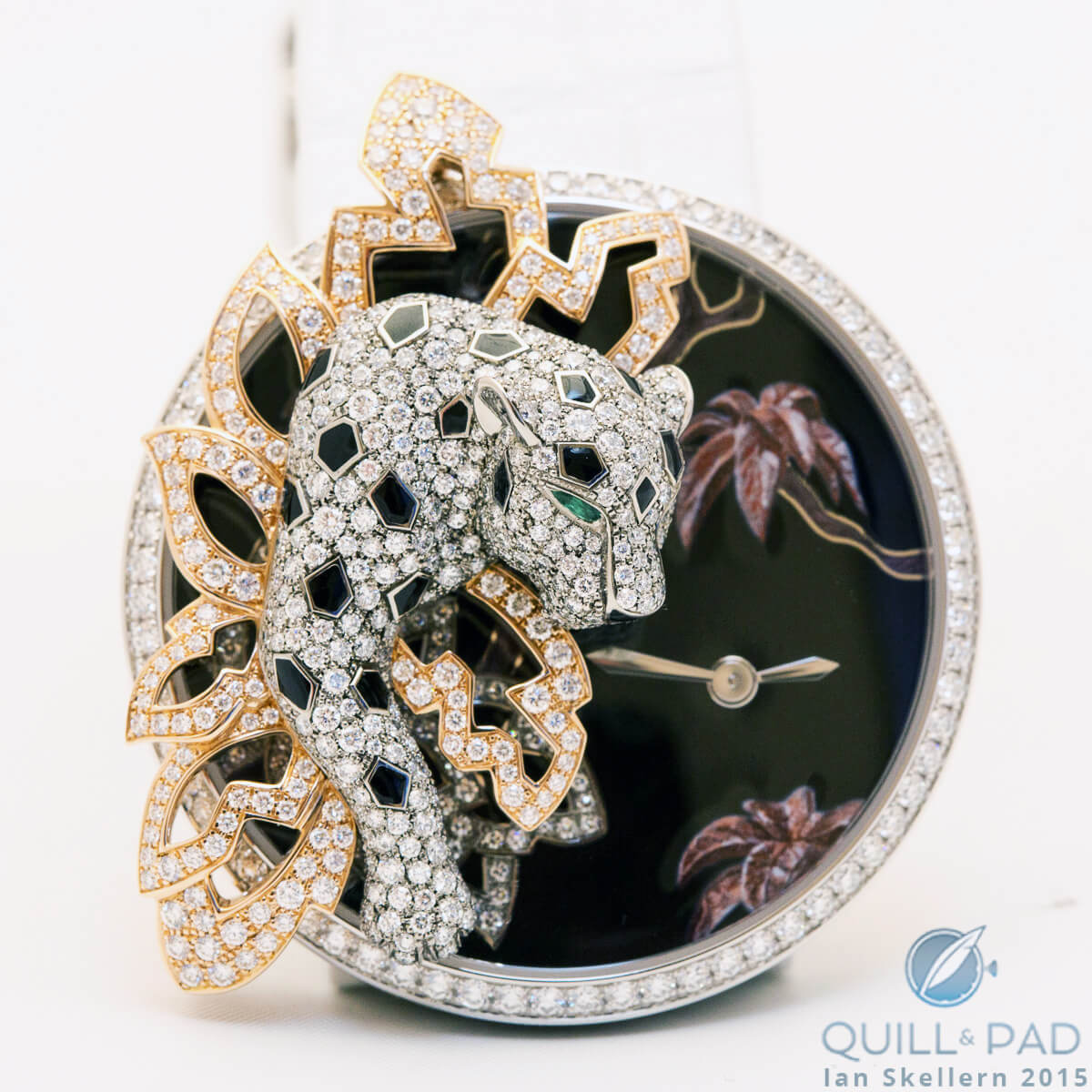 The removable panther on this jewelry timepiece boasts Cartier's version of snow setting