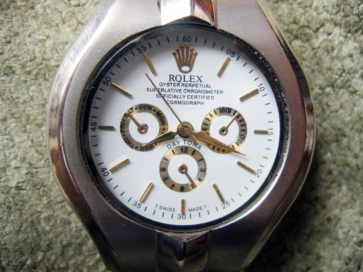 The fact that this fake looks nothing like a Rolex Daytona is one clue; the incorrect spellings of several words on the dial is another