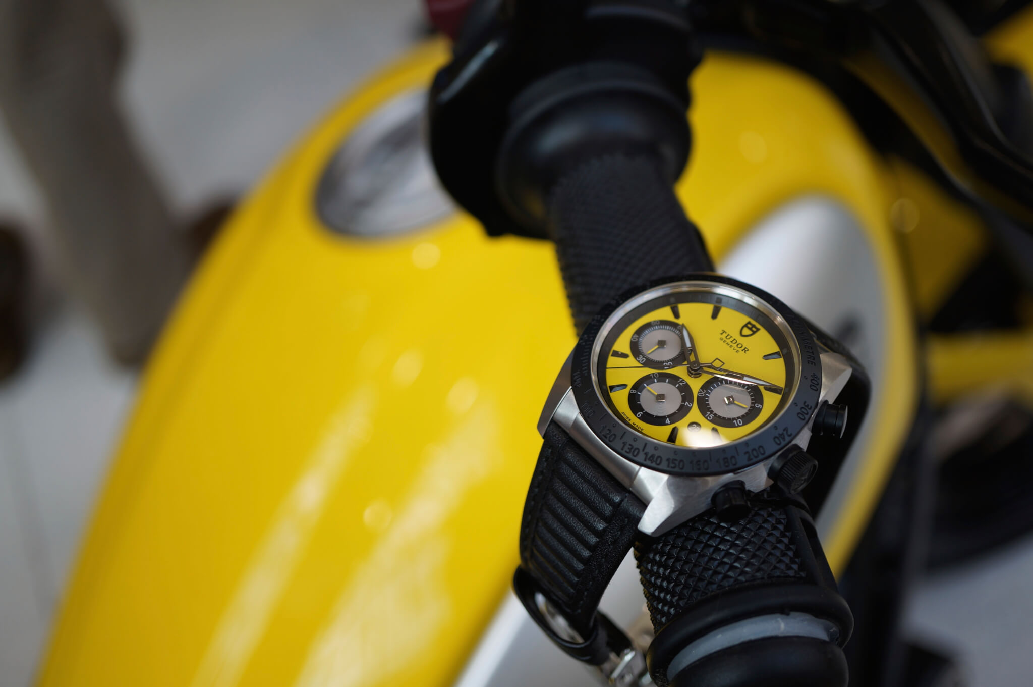 A Tudor Fastrider on a bright yellow Ducati Scrambler at Burrells