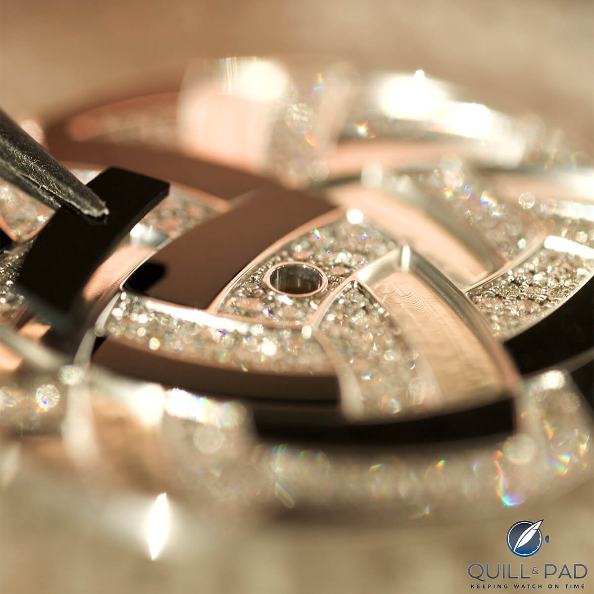 Onyx being carefully set into an Hermès Arceau Temari dial
