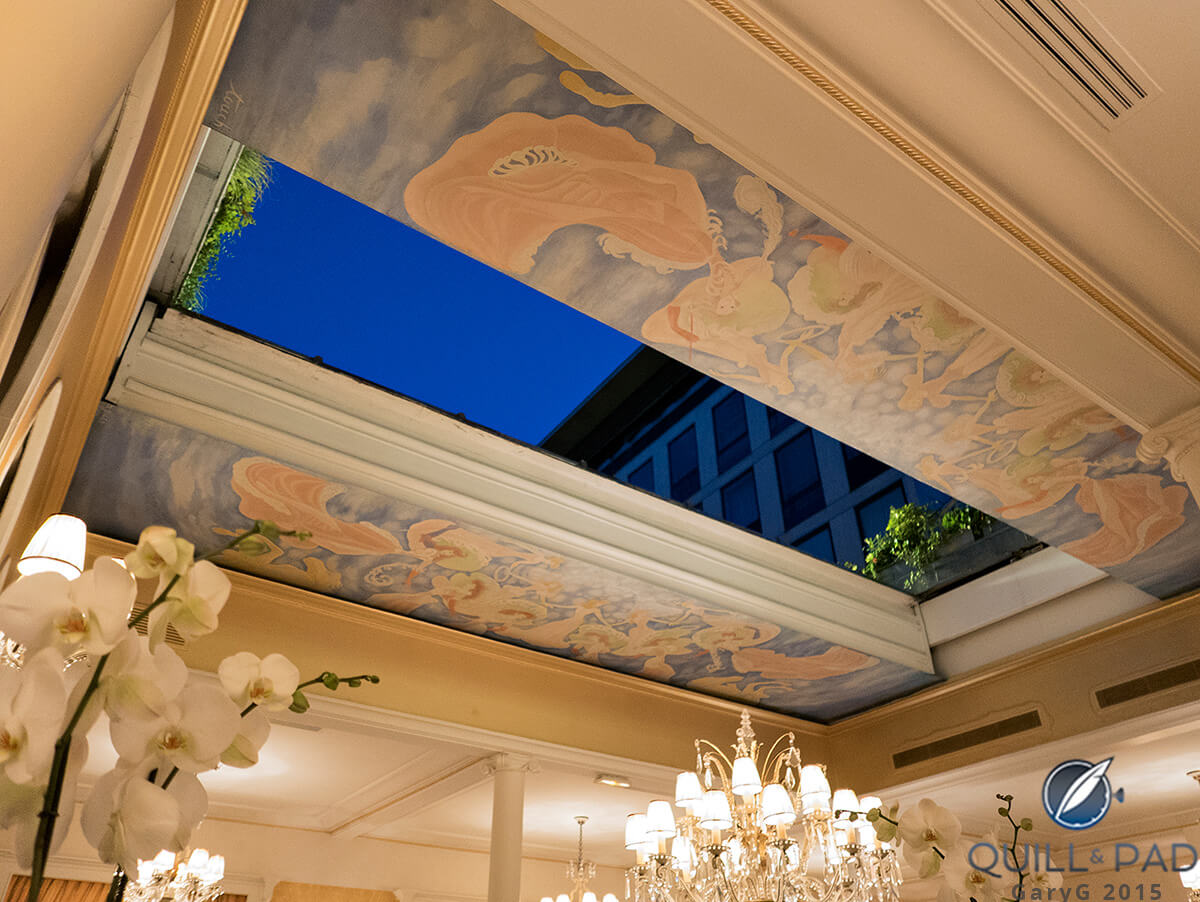 Night sky and roof garden seen through partially opened roof at Lasserre, Paris
