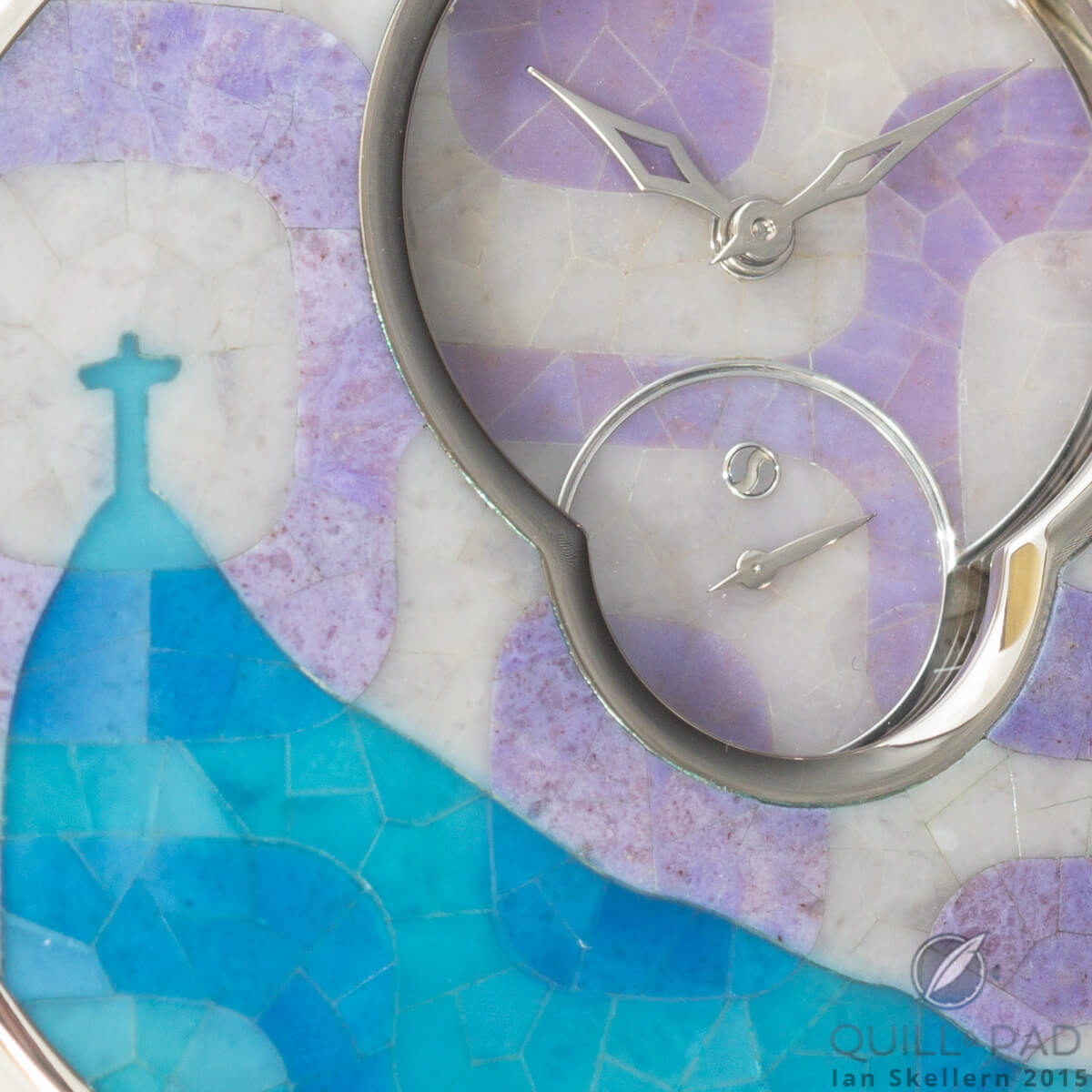 Close up of the micro-marquetry on the Romain Gauthier Logical One Secret Kakau Höfke. The miniature stone work seamlessly flows from the cover down to the time subdials