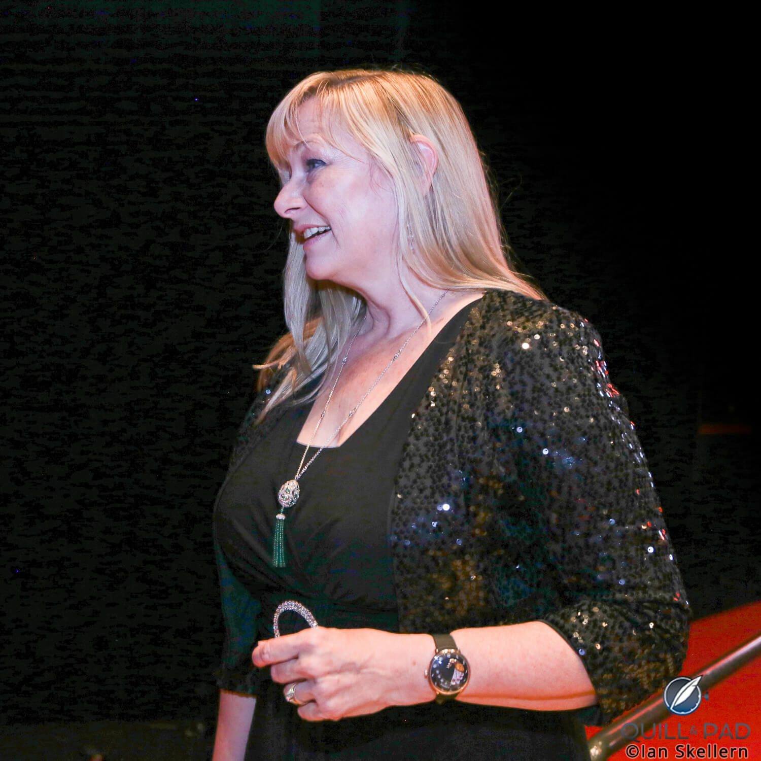 2017 GPHG jury member Elizabeth Doerr on the way to the stage to present a prize with a Fabergé Lady Compliquée Peacock on her wrist