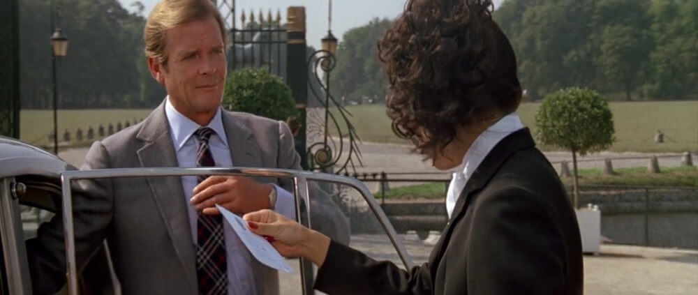 Roger Moore wearing a barely visible two-tone Seiko in 'A View To A Kill'