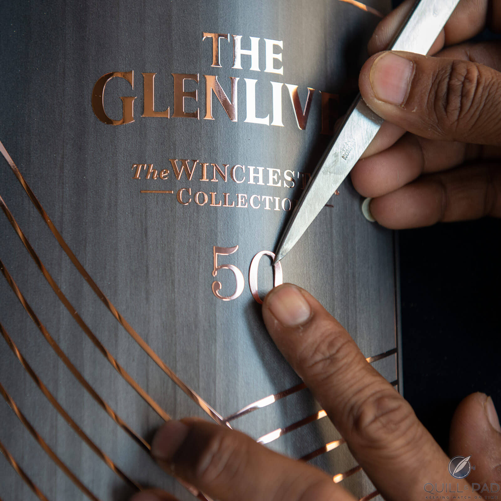 Setting copper text and detailing to the Glenlivet Winchester Collection